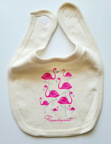 Natural cotton baby bib with a flock of pink flamingos