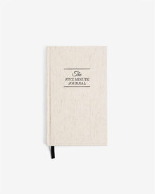 The Five Minute Journal in original linen with black ribbon bookmark.