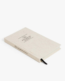 Angled view of The Five Minute Journal in original linen.