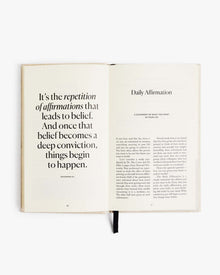 Open journal spread with visible Daily Affirmation text.