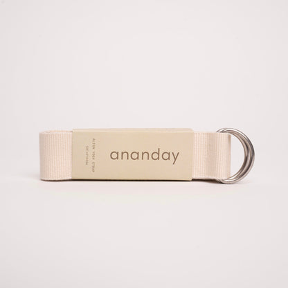 Ananday yoga strap with metal rings on a white background.