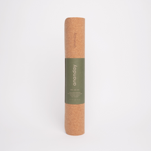 Rolled cork yoga mat with Ananday label on a white background.