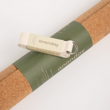 Cork yoga mat with an Ananday yoga strap and metal rings.
