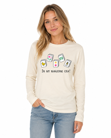 Woman wearing a natural cotton long-sleeve In My Mahjong Era shirt