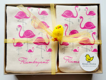 Flamingo natural cotton baby romper and bib set arranged in a clear gift box