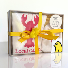 Local Catch natural cotton baby gift set in a clear box with a yellow ribbon