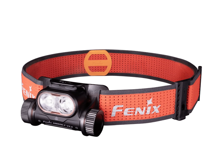 Black Fenix headlamp with an orange perforated headband on a transparent background.