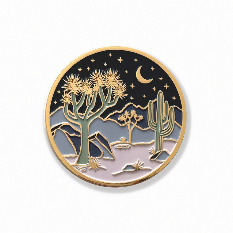 Round Moonlight Joshua Tree coaster with gold trim, crescent moon, stars, desert plants, and blue and lavender enamel