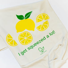 Natural cotton baby blanket with yellow lemons and I Get Squeezed a Lot text