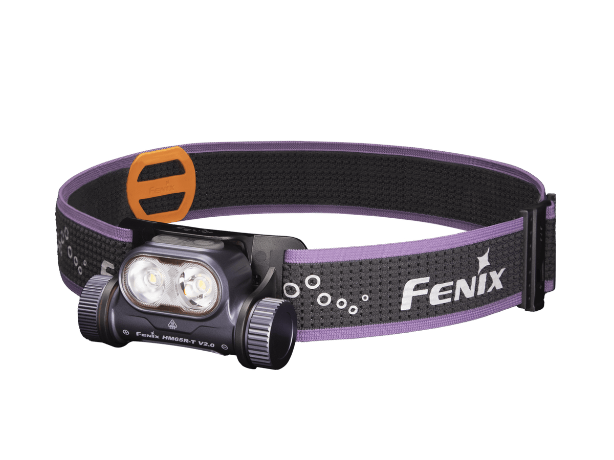 Purple Fenix headlamp with black and purple headband on a transparent background.