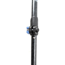 Side-by-side close-ups of a black travel-pole push-button connector.