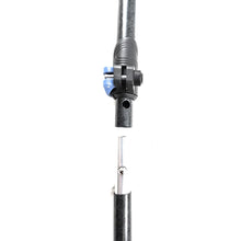 Close-up of a black travel-pole section with a blue push-button connector.