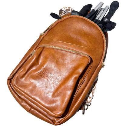 Brown York Nordic backpack holding folded black poles.